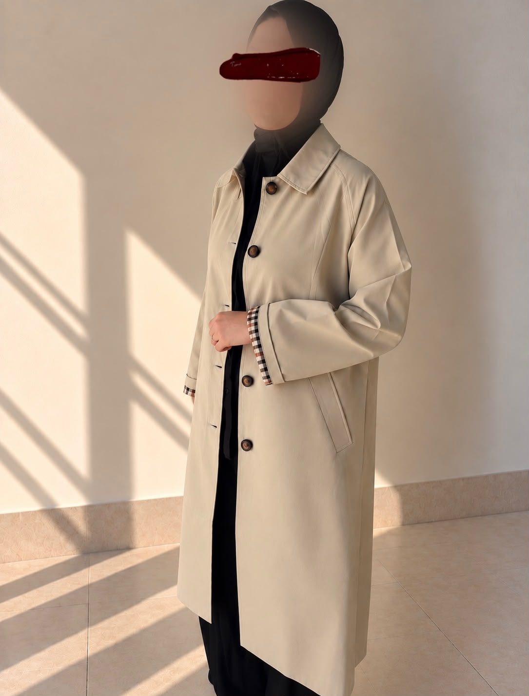 Trench beige long à manches ajustables